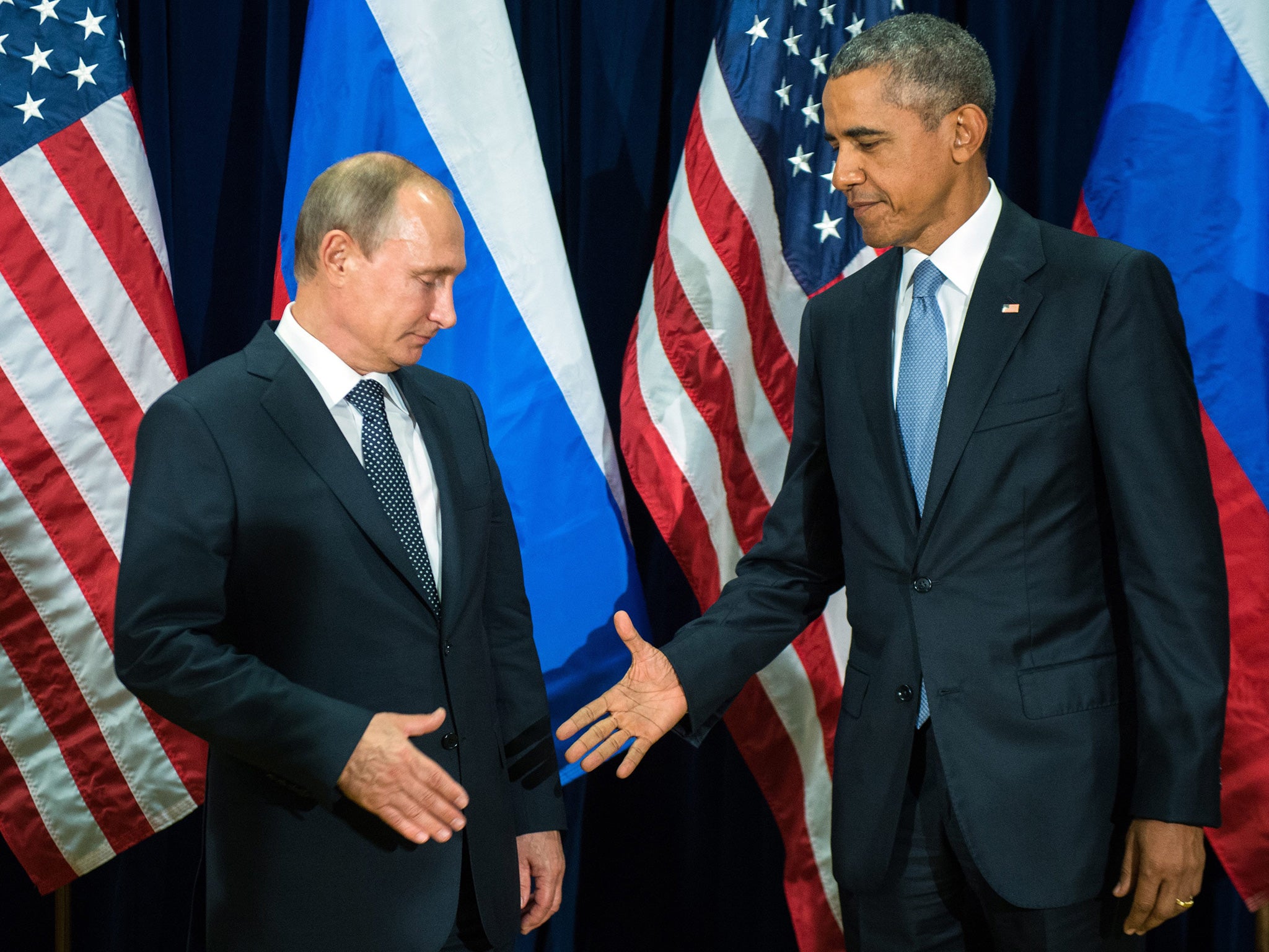 US President Barack Obama and Russian counterpart Vladimir Putin shake hands at a UN meeting in New York