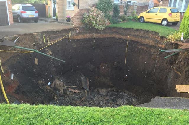 The sinkhole appeared on a residential street overnight