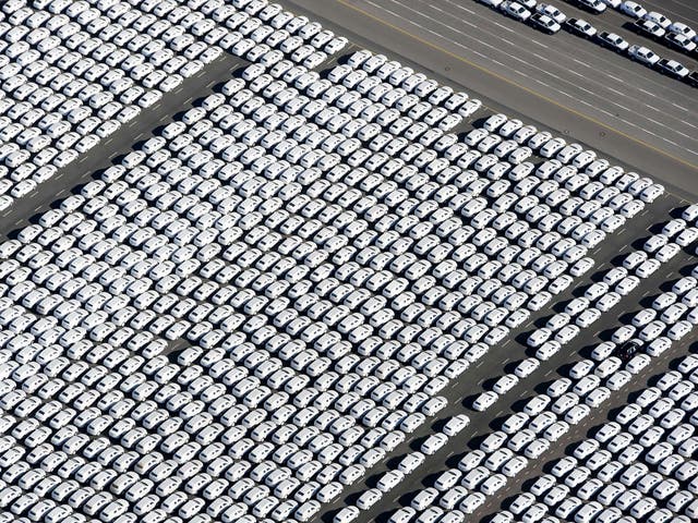 New cars of German car maker Volkswagen (VW) stand ready for shipping next to the Volkswagen plant in Emden, northwestern Germany. Volkswagen, the world's biggest carmaker by sales, has admitted that up to 11 million diesel cars worldwide are fitted with devices that can switch on pollution controls when they detect the car is undergoing testing
