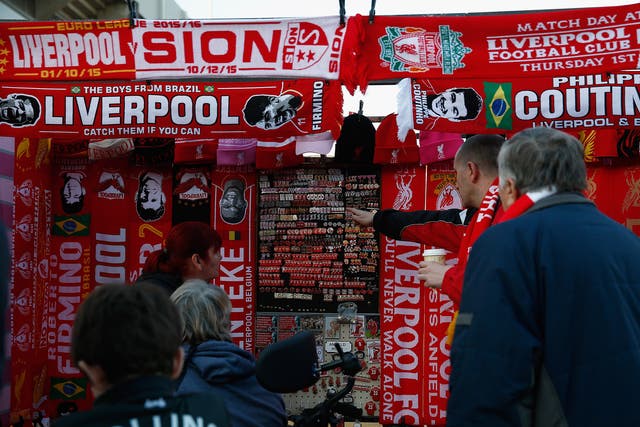 Fans peruse merchandise stalls outside Anfield ahead of tonight's Europa League clash