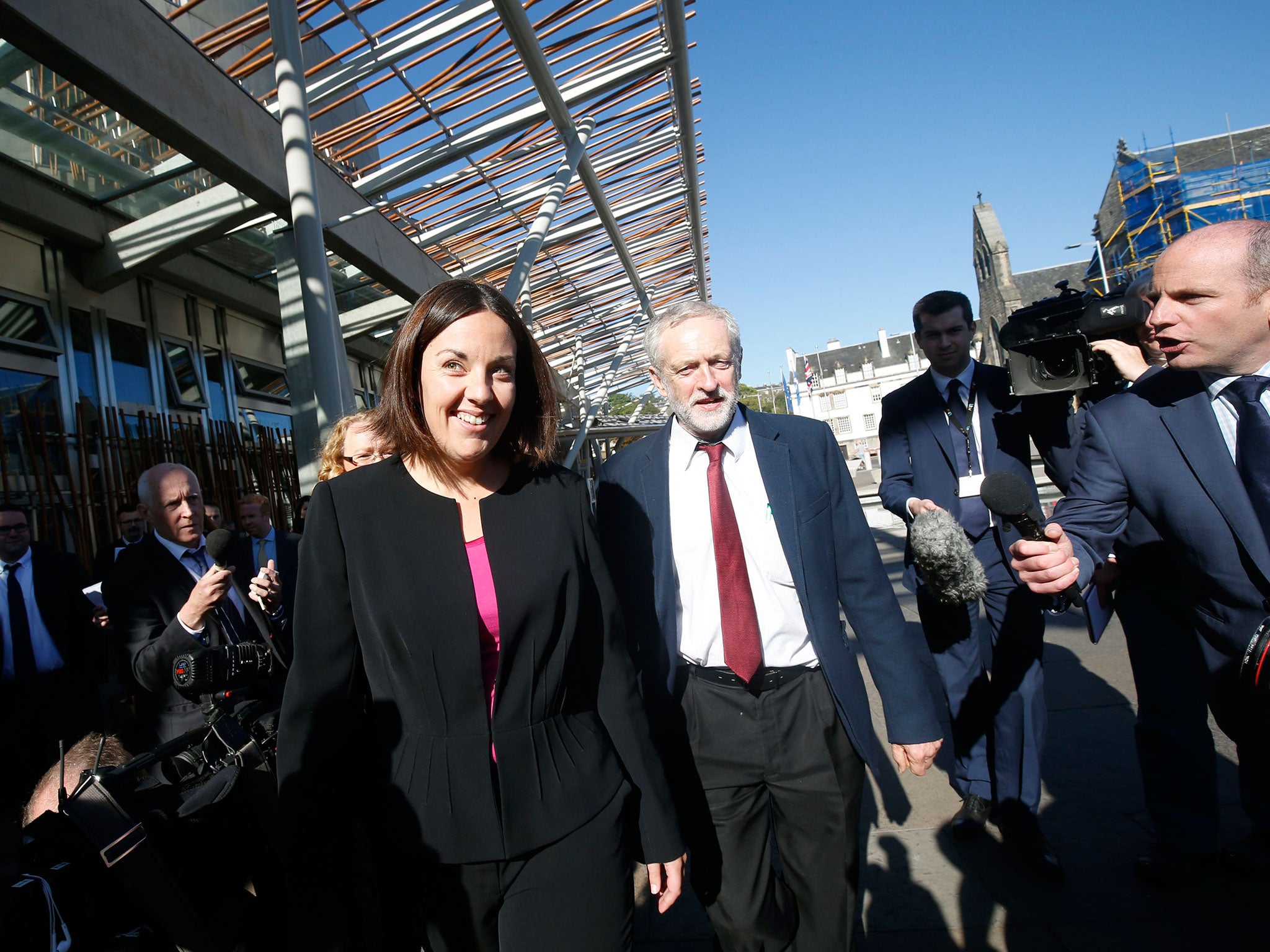 Jeremy Corbyn and Kezia Dugdale arriving at the Scottish Parliament building