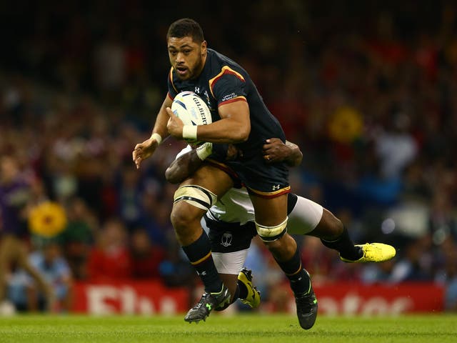 Wales No 8 Taulupe Falatau in action against Fiji