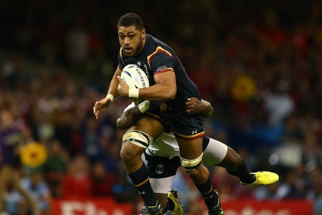 Wales No 8 Taulupe Falatau in action against Fiji