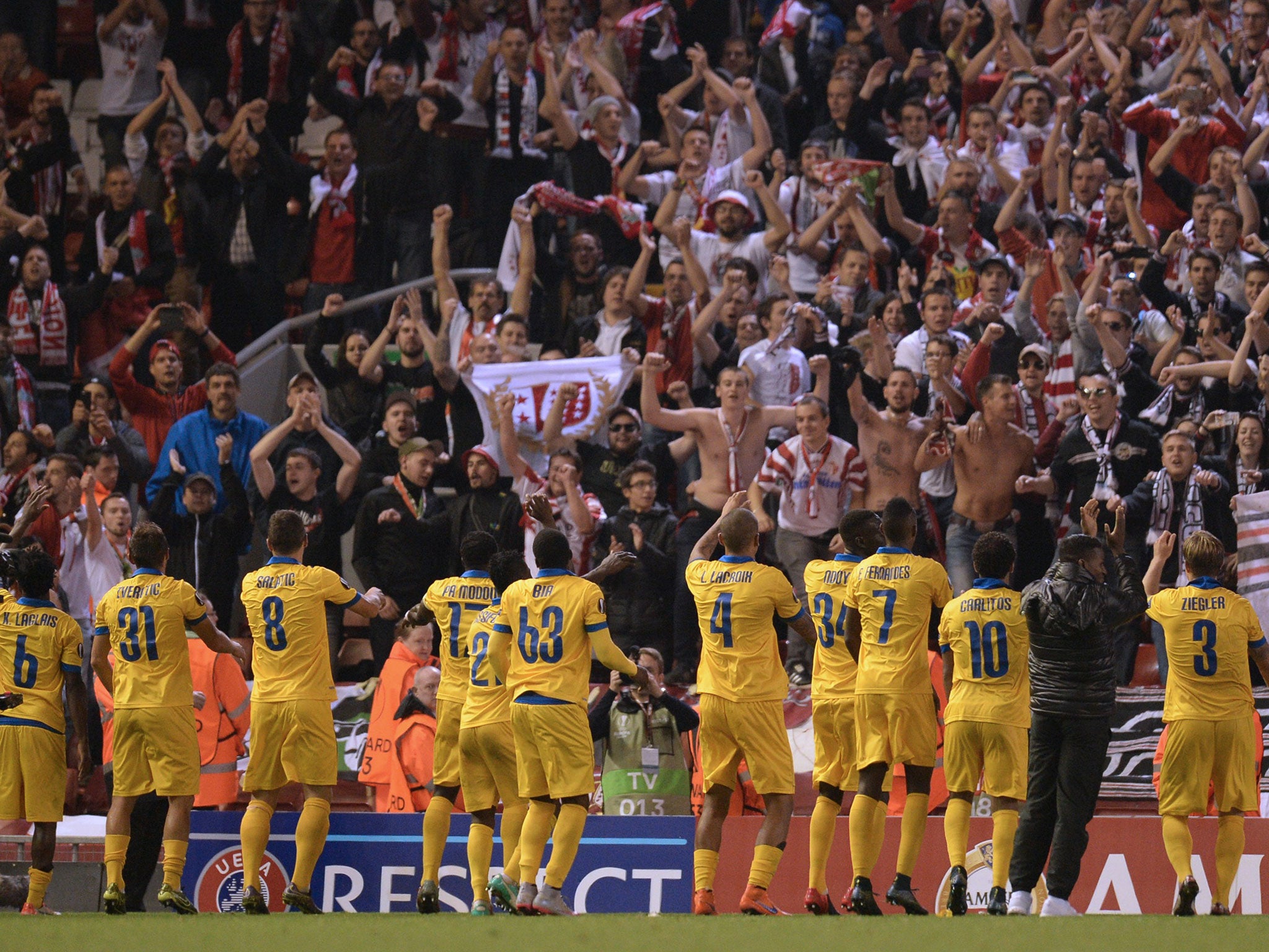 FC Sion players celebrate a draw at Liverpool