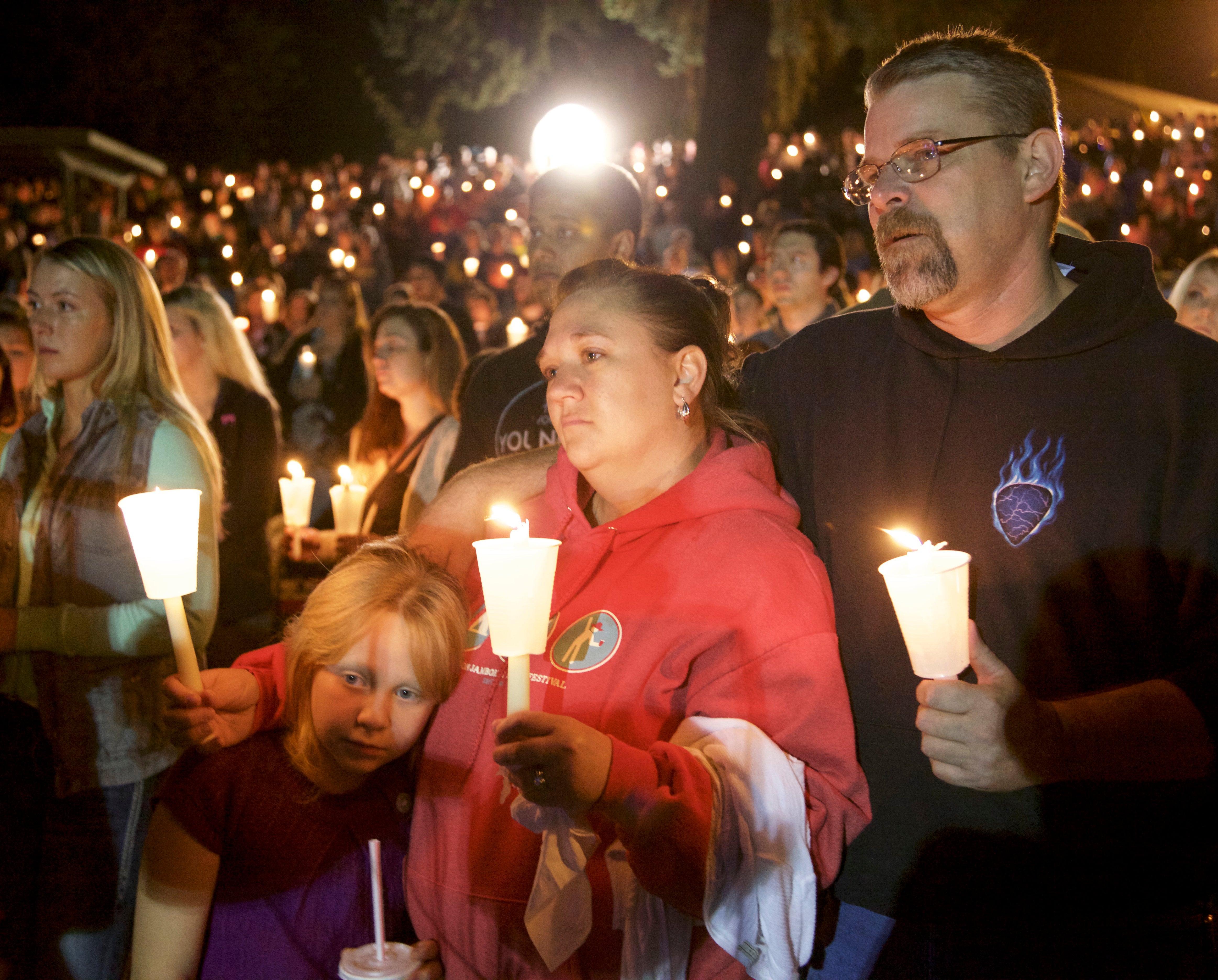 Residents of Roseburg, Oregon gather at a vigil to remember the victims of the latest American mass shooting at Umpqua Community College