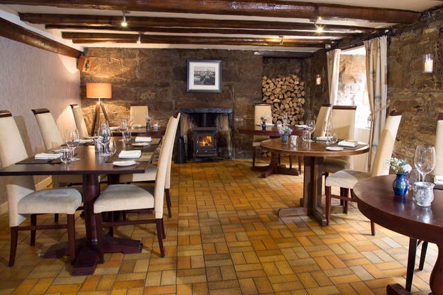 The crepuscular dining room, holding just seven tables, is as snug as a smugglers' den