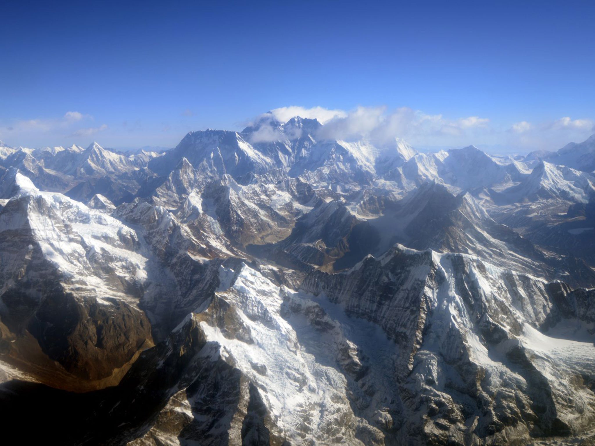 An aerial view of Mount Everest (C) and The Himalayan mountain range