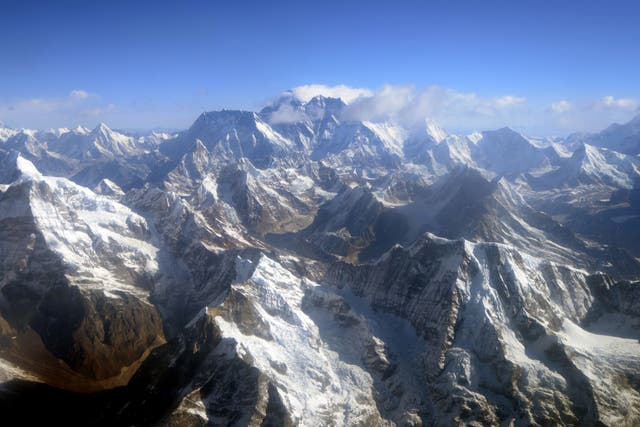 An aerial view of Mount Everest (C) and The Himalayan mountain range