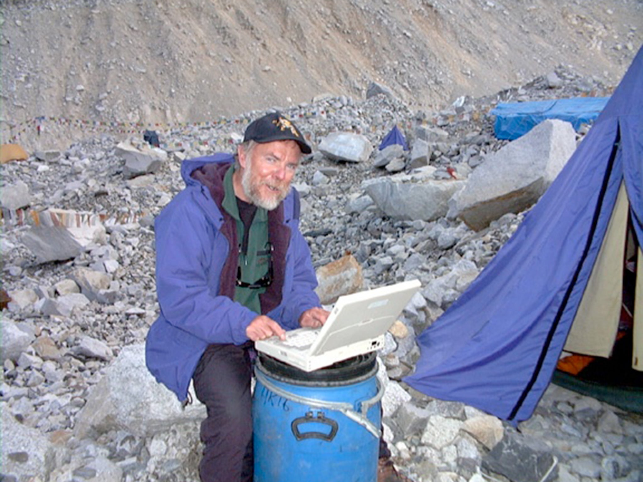 Stephen Goodwin writing his Everest Diary at Base Camp