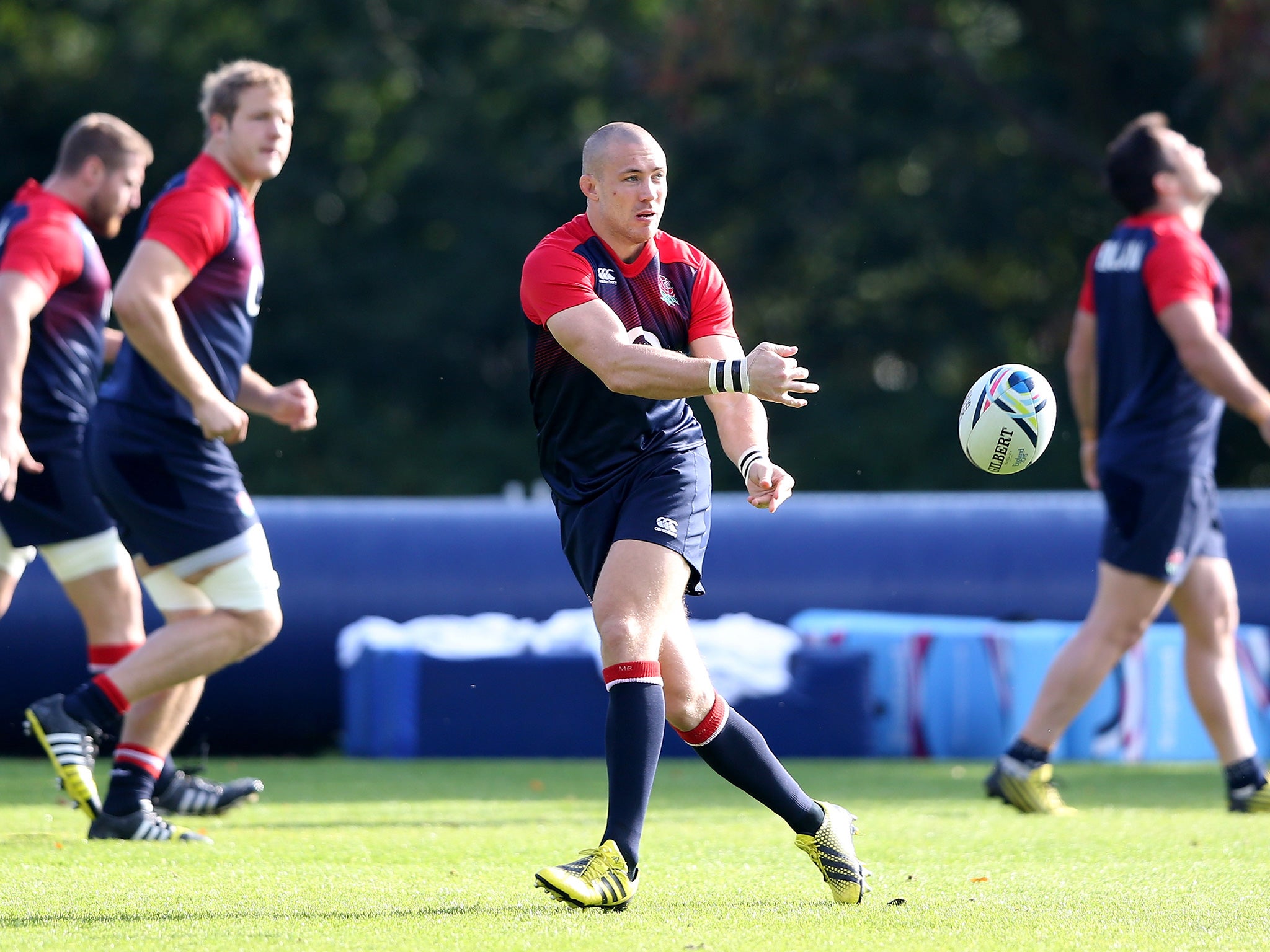 Mike Brown passes the bal during the England training session at Pennyhill Park