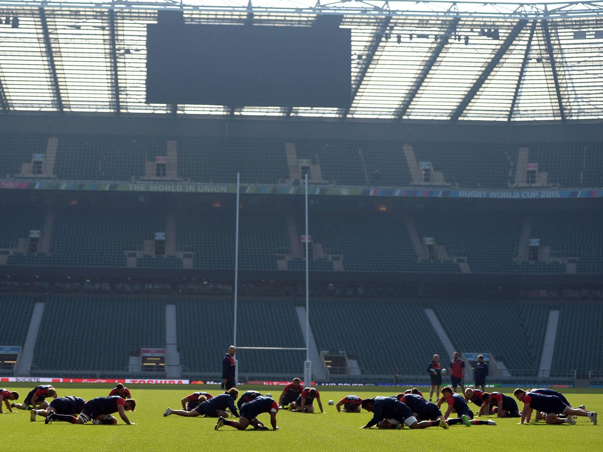 England's players stretch during a captains run at Twickenham Stadium, London