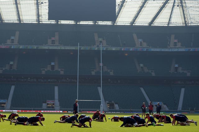 England's players stretch during a captains run at Twickenham Stadium, London