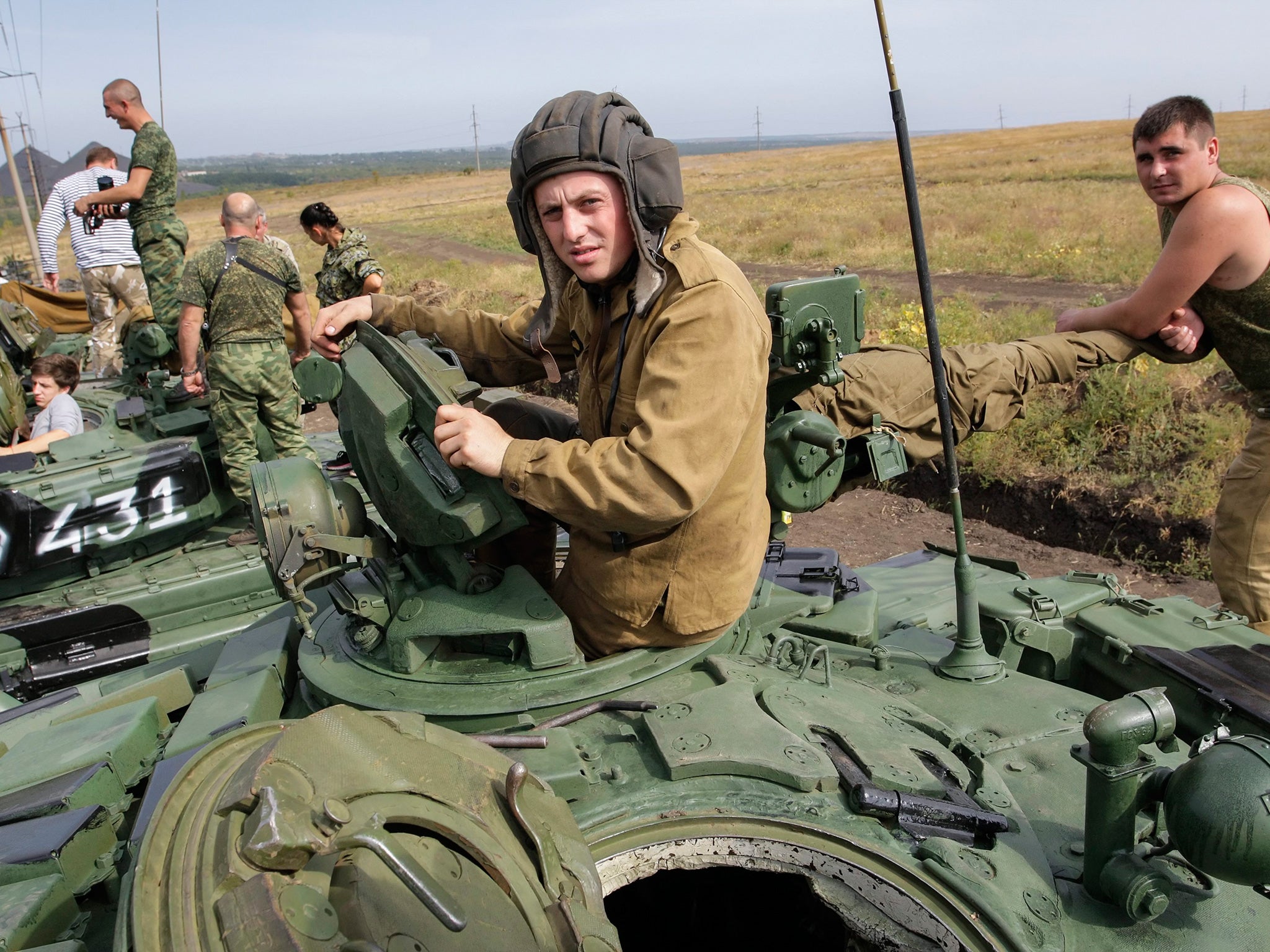 Pro-Russian militants in action with tanks during their training on a shooting range near of Torez city, about 75 kilometers from of Donetsk