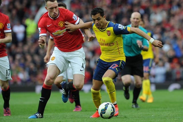 Phil Jones and Alexis Sanchez compete for the ball during Manchester United vs Arsenal