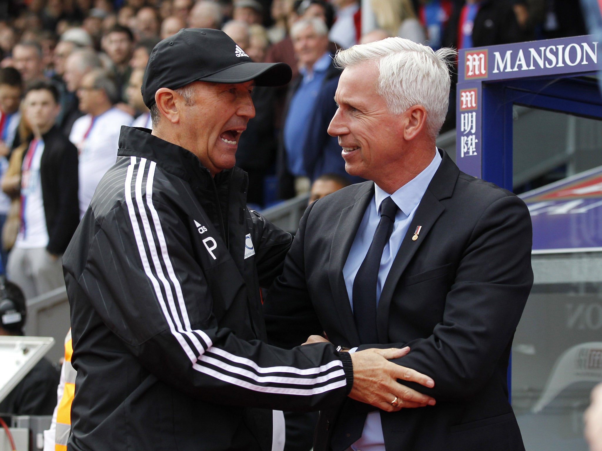 Tony Pulis and Alan Pardew shake hands before today's lunchtime kick-off