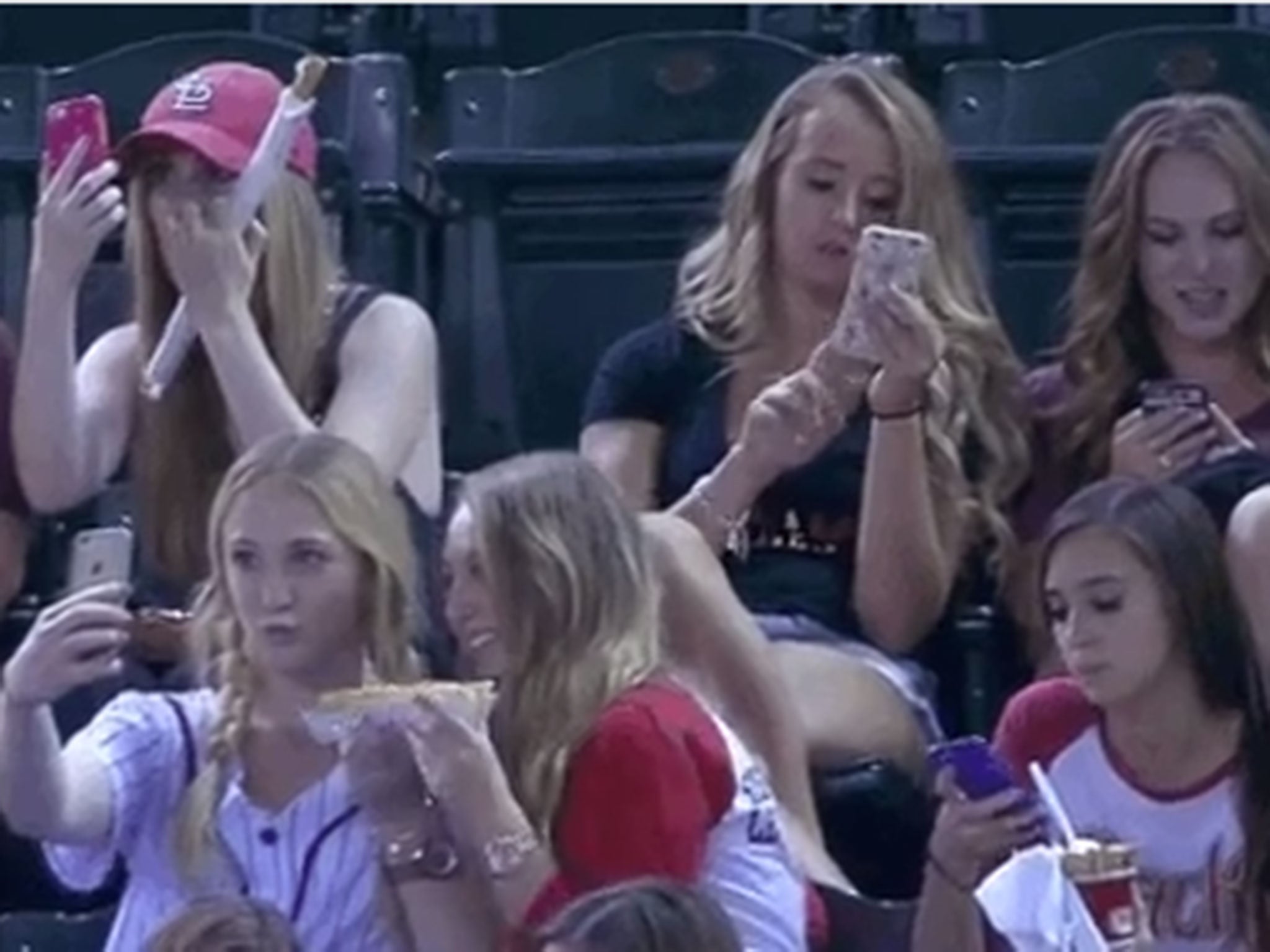 The girls were mocked for taking selfies at a baseball game