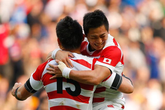 Kosei Ono, right, and Ayumu Goromaru celebrate after the victory over Samoa