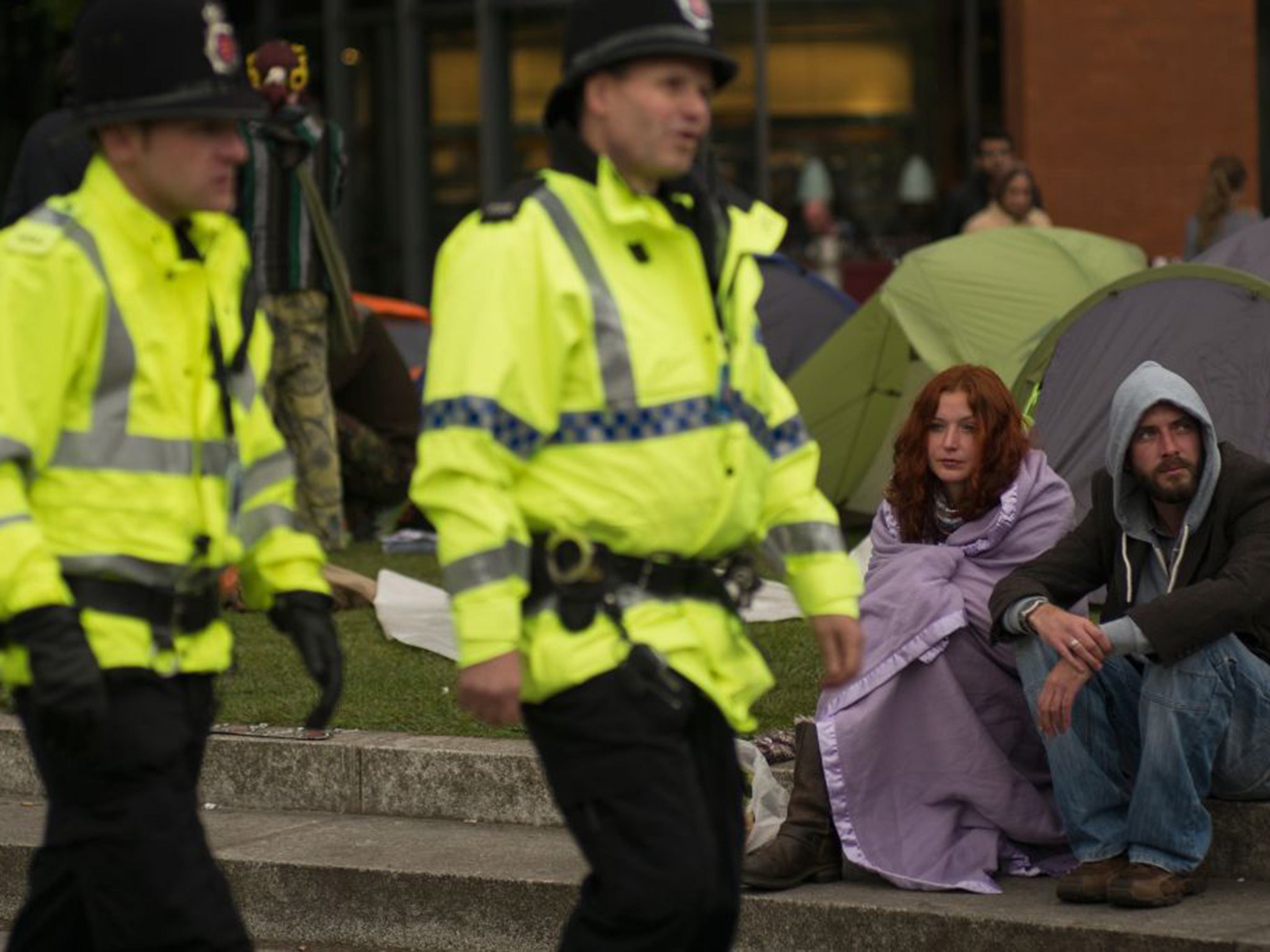 Anti-austerity protesters gather in Manchester's Piccadilly Gardens on the eve of the 2015 annual Conservative Party Conference