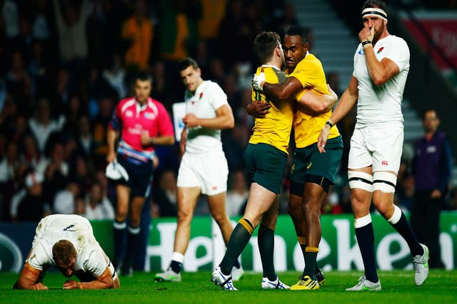 Australia celebrate their second try against England