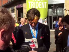 Tory egged after brandishing Thatcher picture at protesters