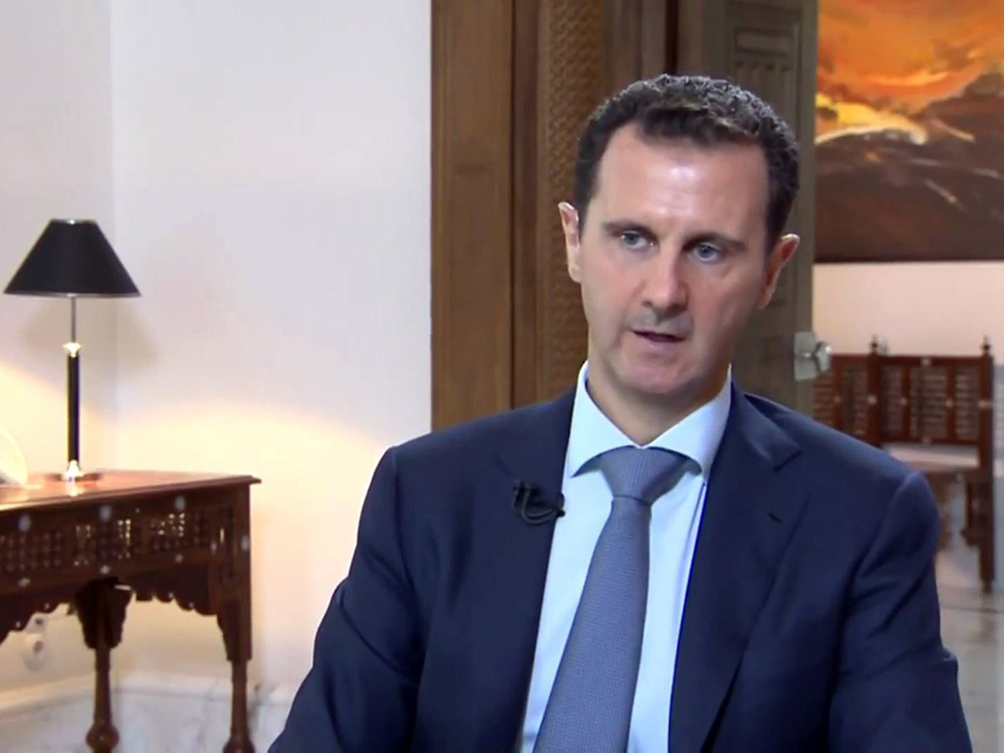 Syrian President Bashar al-Assad speaking during an interview in Damascus broadcast by Khabar TV