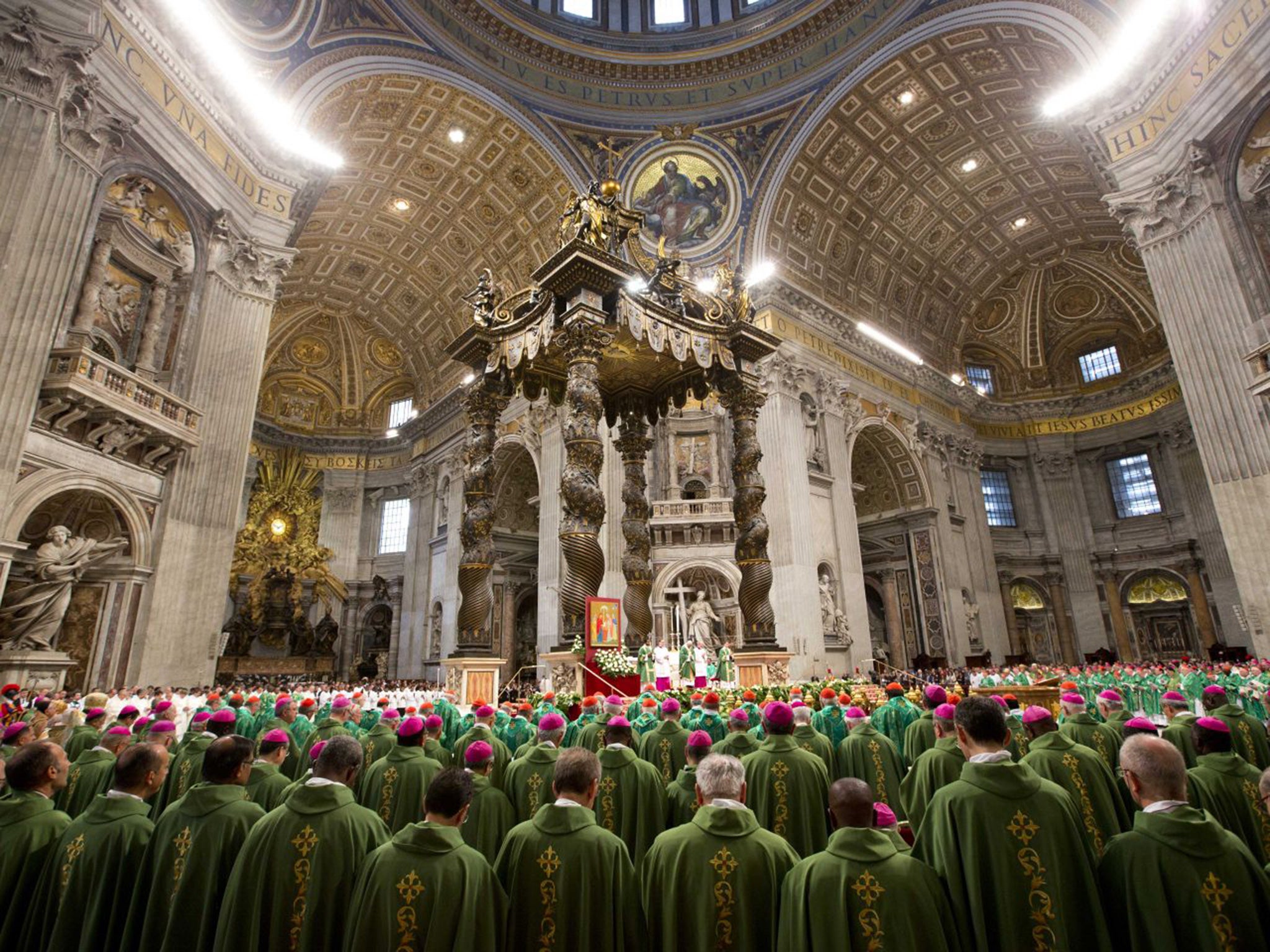 Bishops and cardinals pray as Pope Francis celebrates the opening Mass of the Synod of bishops, in St. Peter's Basilica