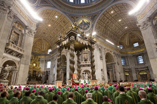 Bishops and cardinals pray as Pope Francis celebrates the opening Mass of the Synod of bishops, in St. Peter's Basilica