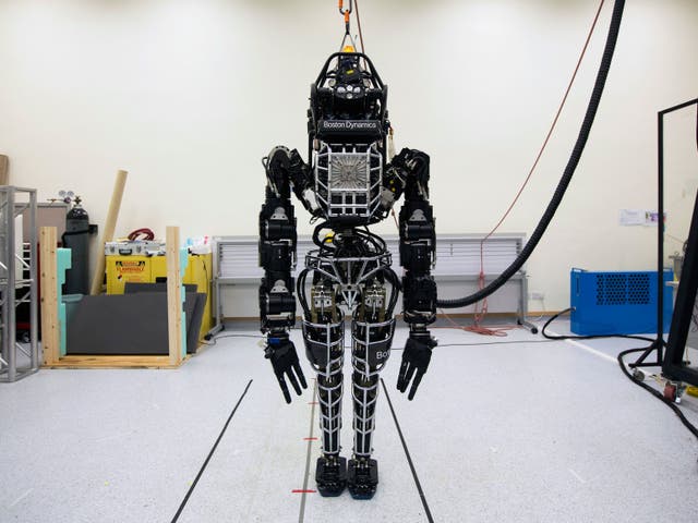 Bipedal humanoid robot "Atlas", primarily developed by the American robotics company Boston Dynamics, is presented to the media during a news conference at the University of Hong Kong October 17, 2013