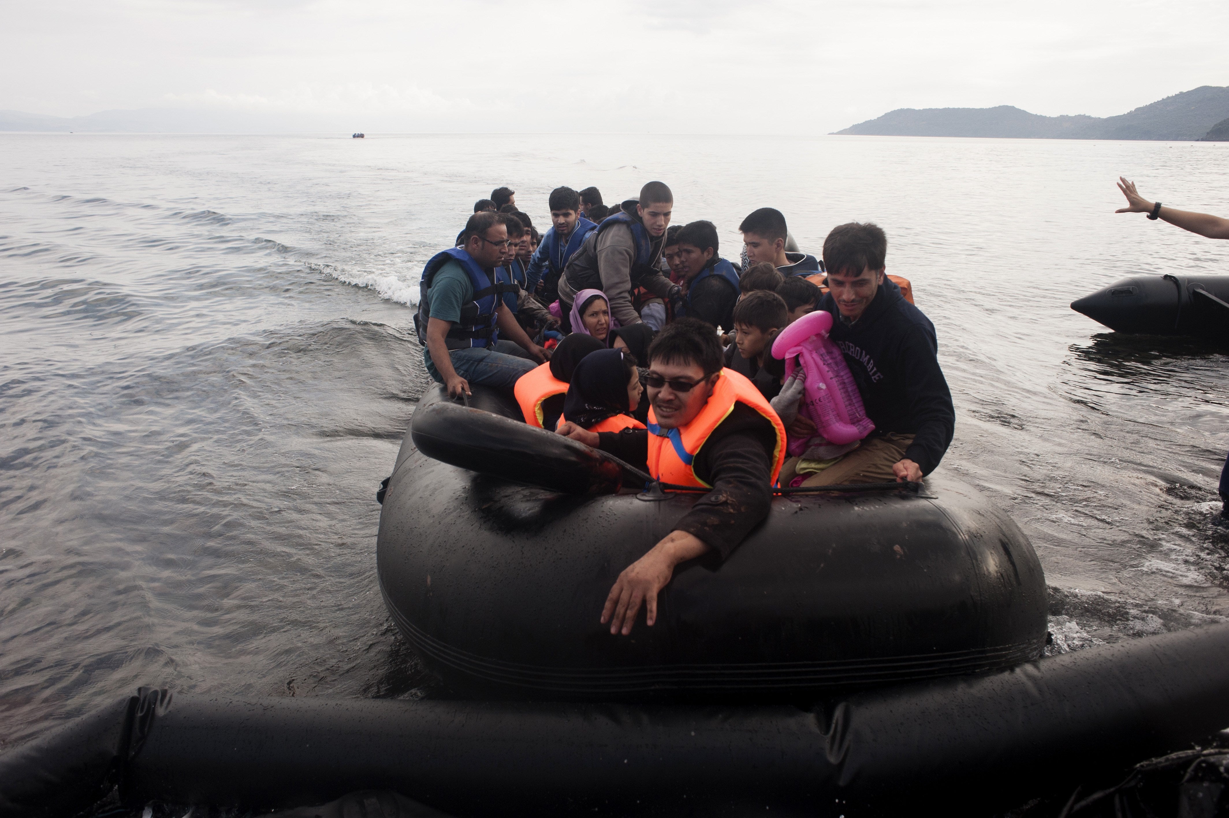 Refugees arrive on the Greek island of Lesbos, after crossing the Aegean sea from Turkey