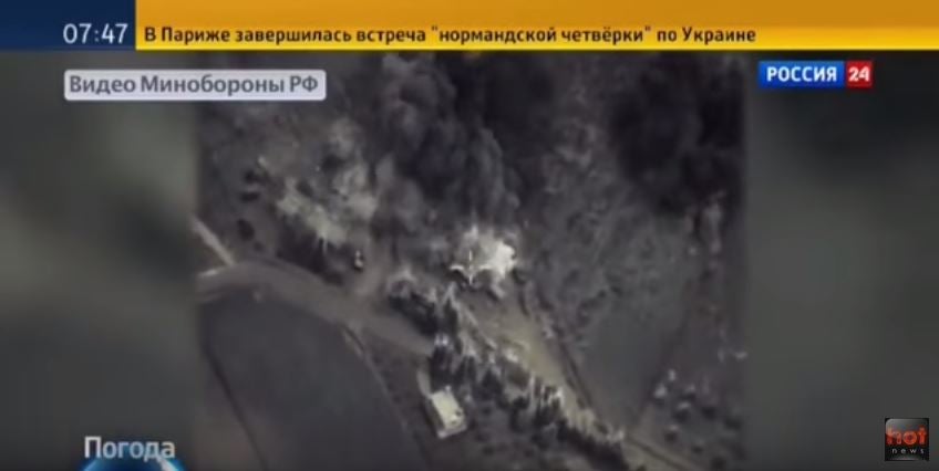 Ariel footage showing the Syrian countryside being bombed-out features as a backdrop