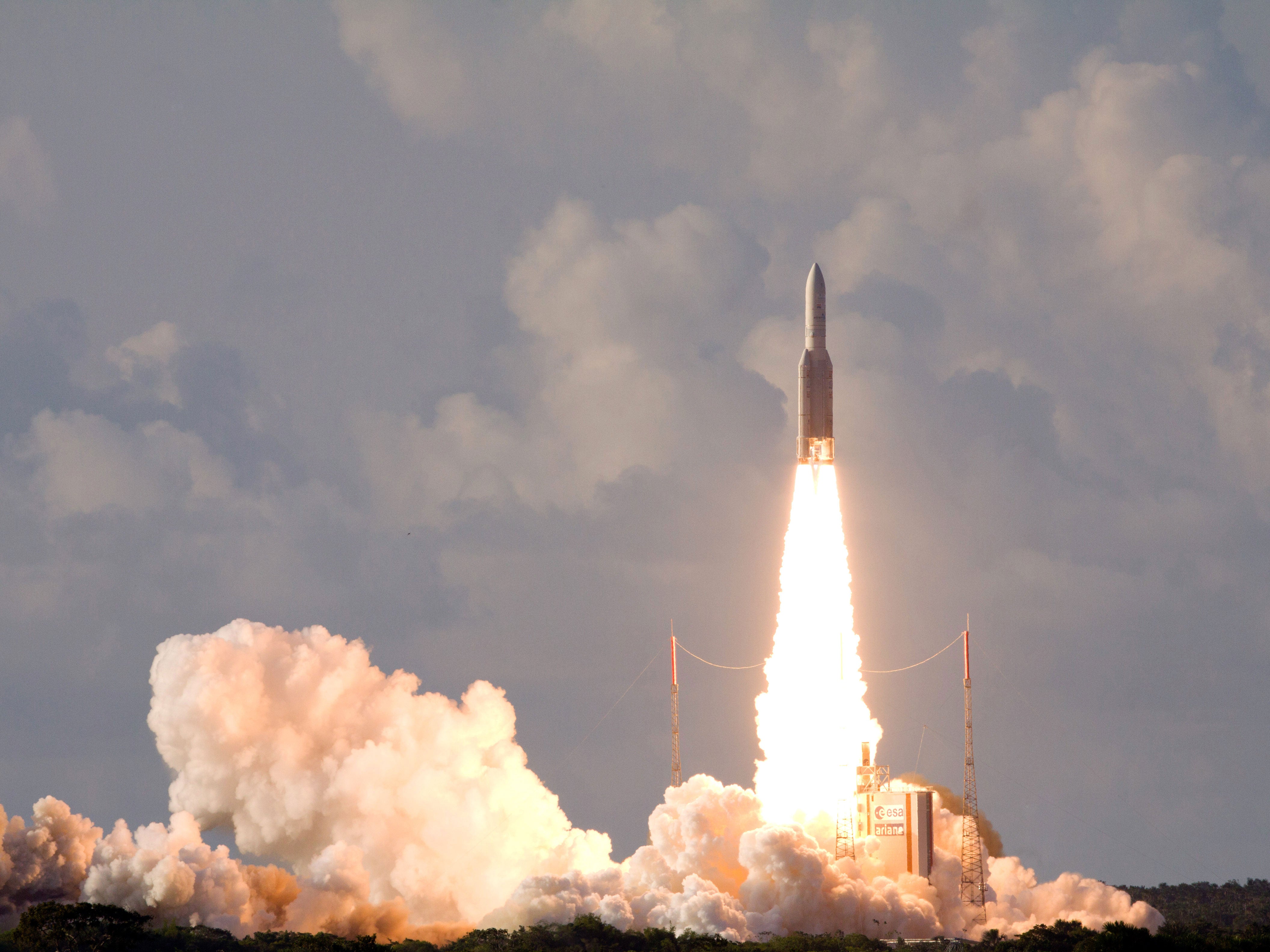 An Ariane-5 rocket, carrying two telecommunication satellites Eutelsat 25B/ Eshail1 (France/Qatar) and GSAT-7 (India) blasts off from the European space centre of Kourou, French Guiana on August 30, 2013