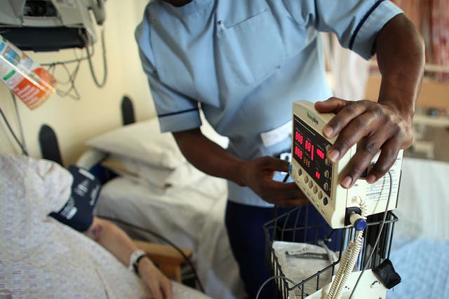 A nurse tends to recovering patients on a general ward at The Queen Elizabeth Hospital on March 16, 2010 in Birmingham, England