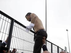 Air France bosses, shirts ripped from their backs, flee protesters