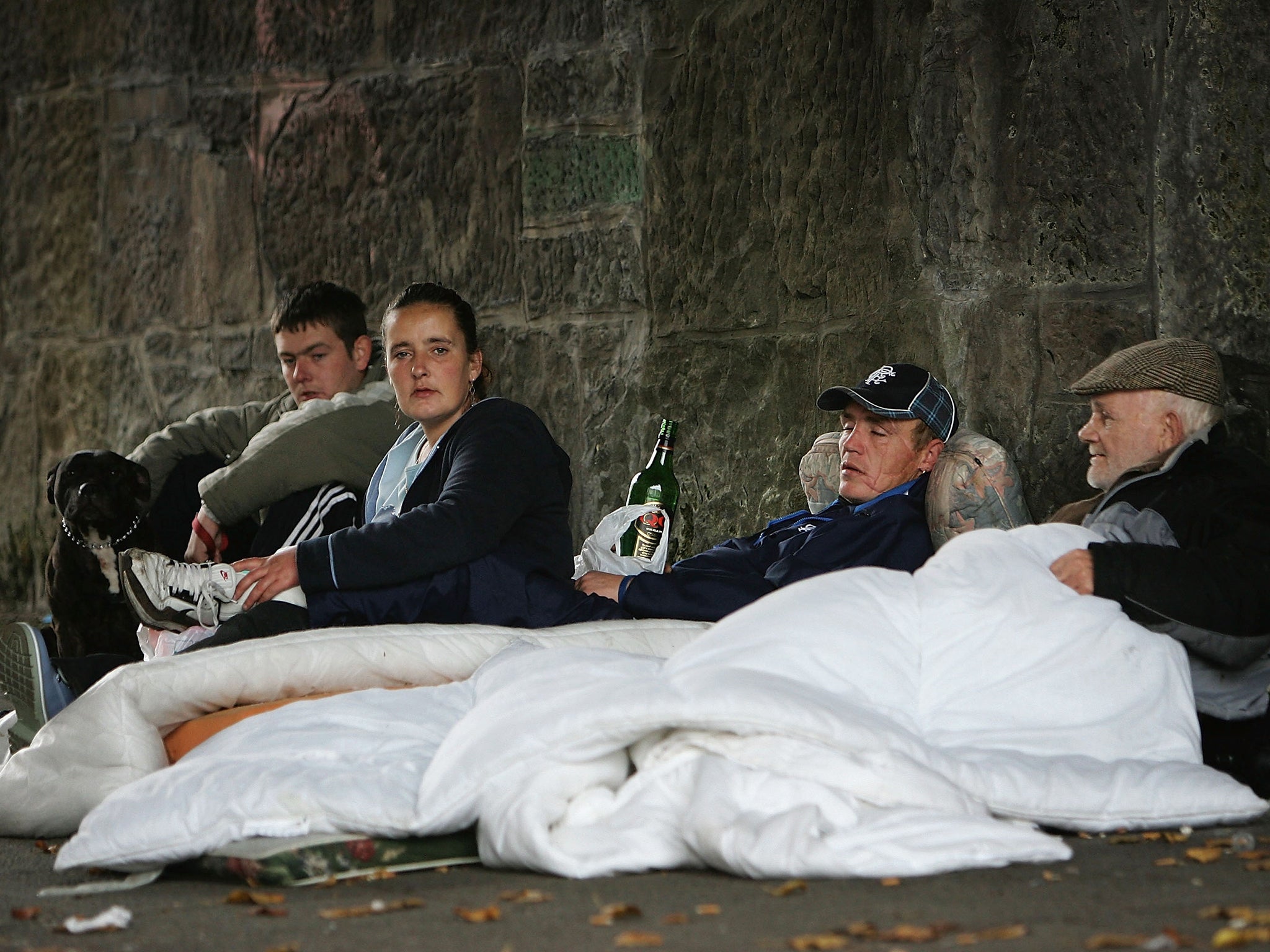 Homeless people sit under a bridge on the banks of the River Clyde in Glasgow. Homeless charity Shelter is one of the organisations calling for the biggest house building programme in Scotland since the 1970s