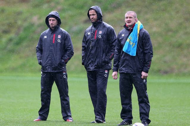 From left: Mike Catt, Andy Farrell and Graham Rowntree watch an England training session