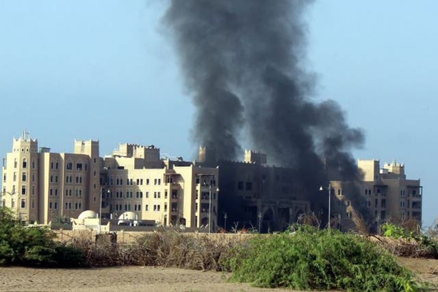 The Al-Qasr Hotel after it was hit by rockets