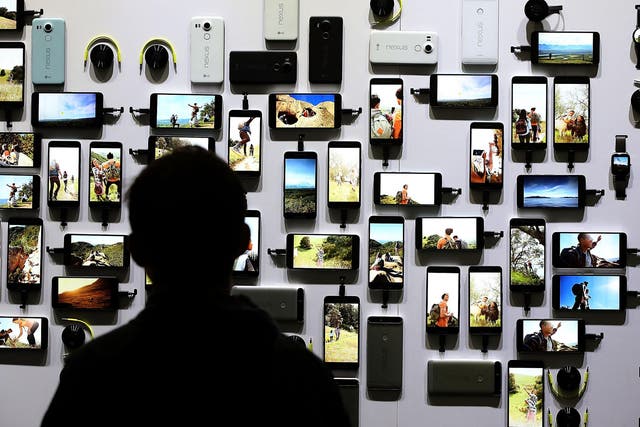 An attendee looks at a display of new Google devices during a Google media event on September 29, 2015 in San Francisco, California