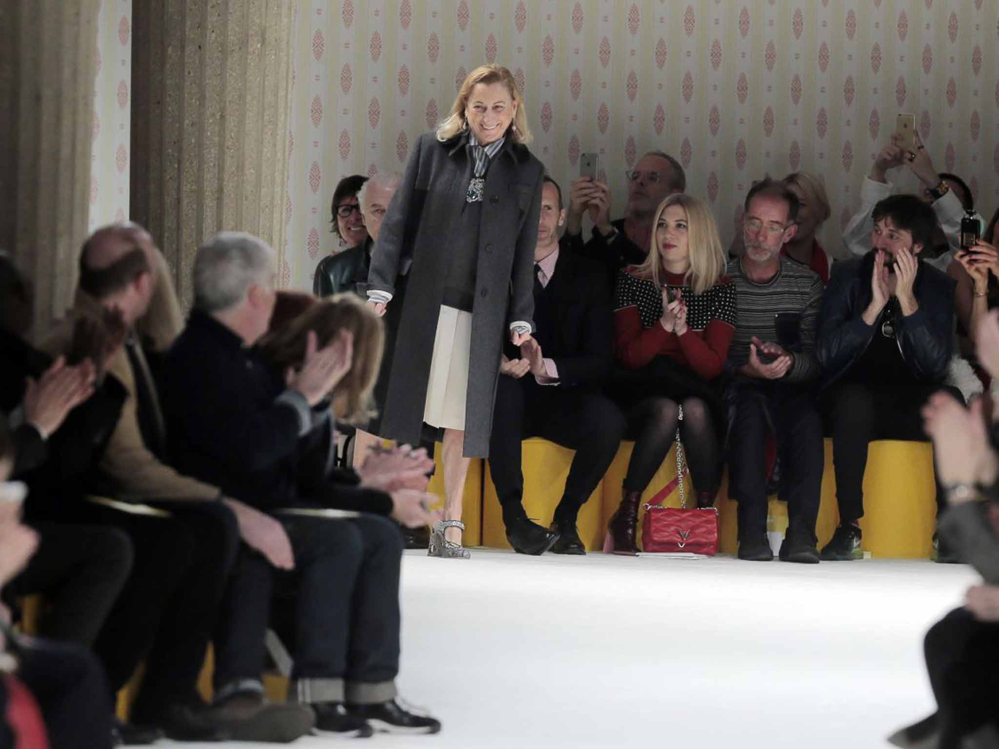 Miuccia Prada takes the applause after the presentation of Miu Miu's ready-to-wear fall-winter 2015-2016 collection at Paris fashion week