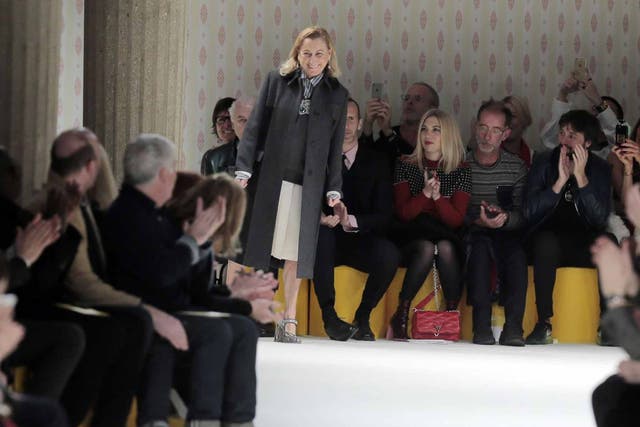 Miuccia Prada takes the applause after the presentation of Miu Miu's ready-to-wear fall-winter 2015-2016 collection at Paris fashion week