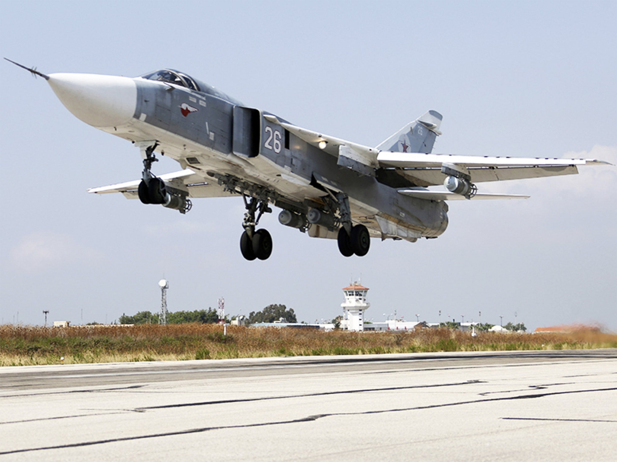 As Russian air stikes in Syria intensify, a SU-24M jet fighter takes off from a Syrian airbase