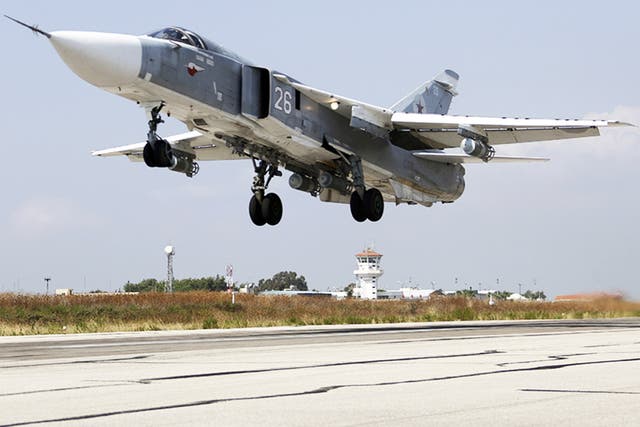 As Russian air stikes in Syria intensify, a SU-24M jet fighter takes off from a Syrian airbase