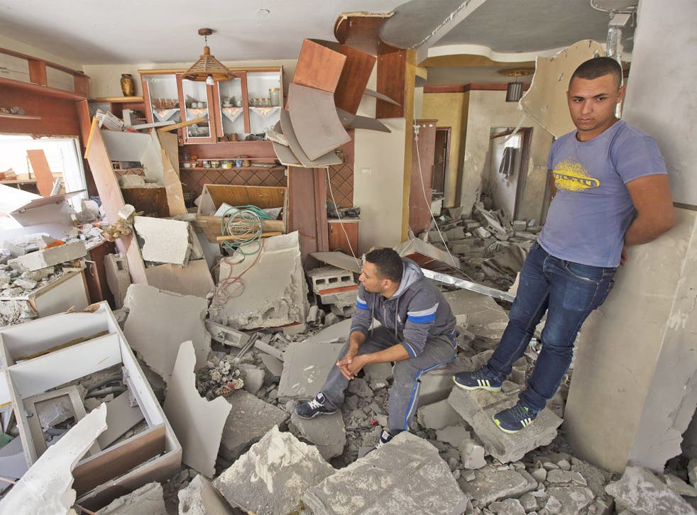 Palestinians inspect what was left of Ghassan Abu Jamal’s house after the Israeli army blew it up in Jabal Mukaber in East Jerusalem