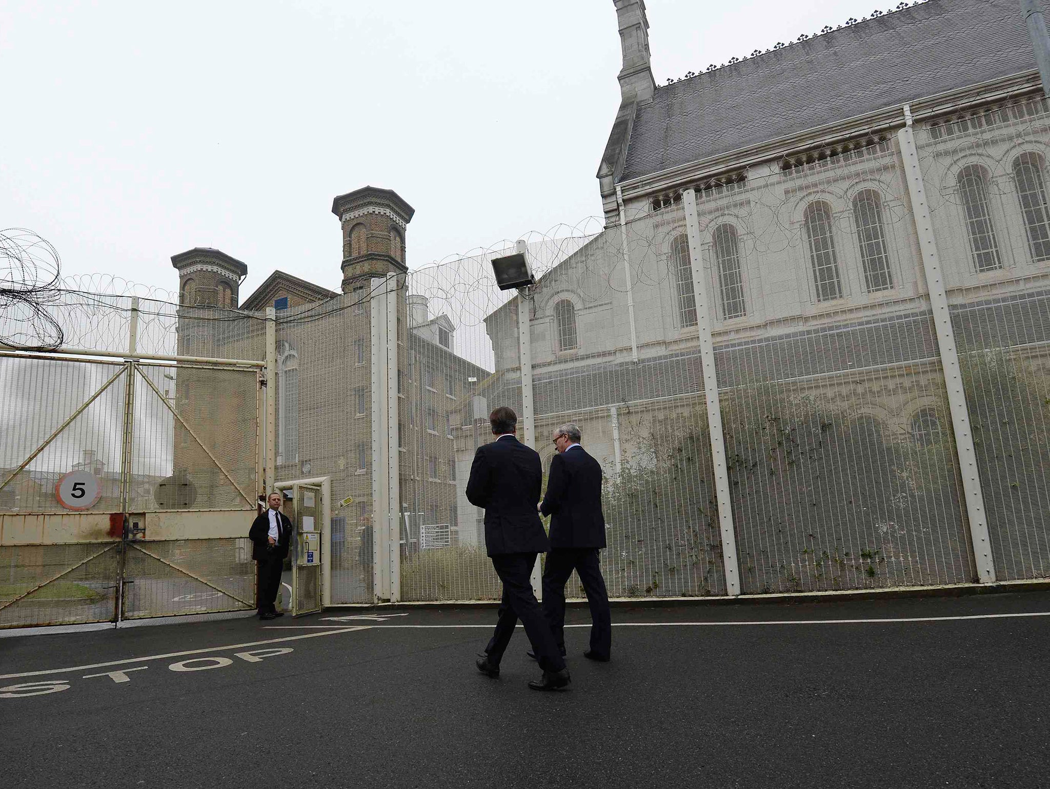 David Cameron is shown around Wormwood Scrubs prison in London in 2012