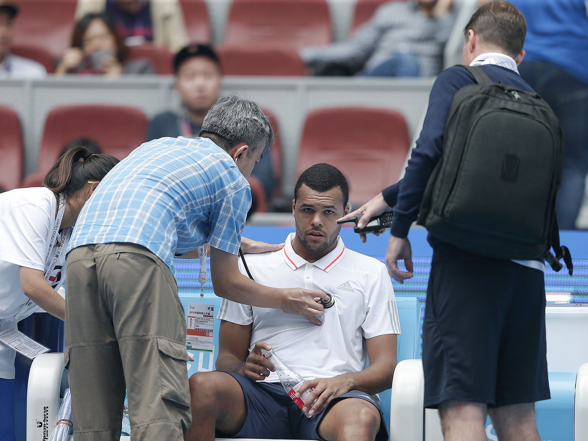 Jo-Wilfried Tsonga is given treatment at the China Open