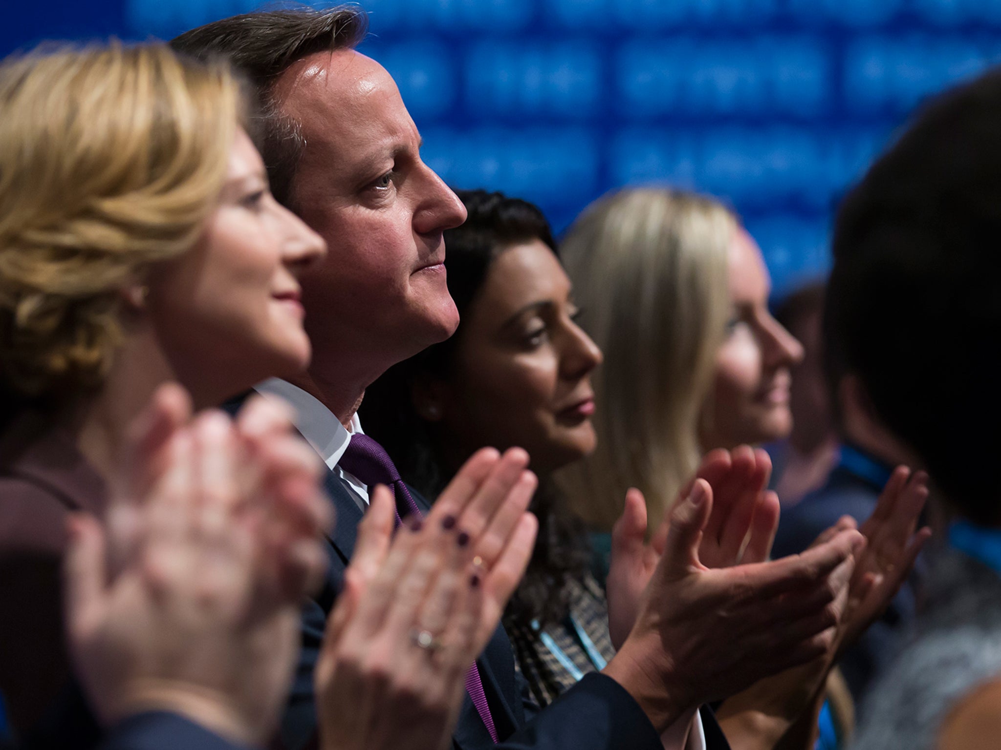 David Cameron applauds after listening to a speech by Chancellor of the Exchequer George Osborne, during the Conservative Party Conference, in Manchester
