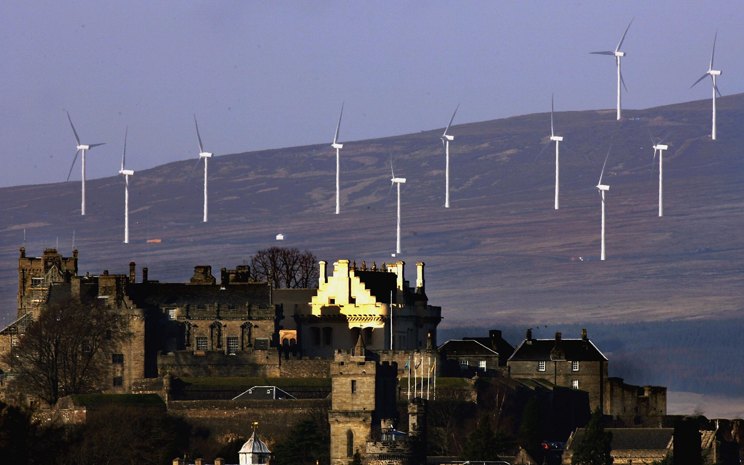 Wind turbines line the hillside in Stirling, Scotland