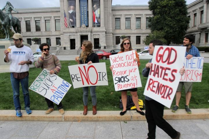 Renoir Sucks protestors gather outside the Museum Fine Arts in Boston