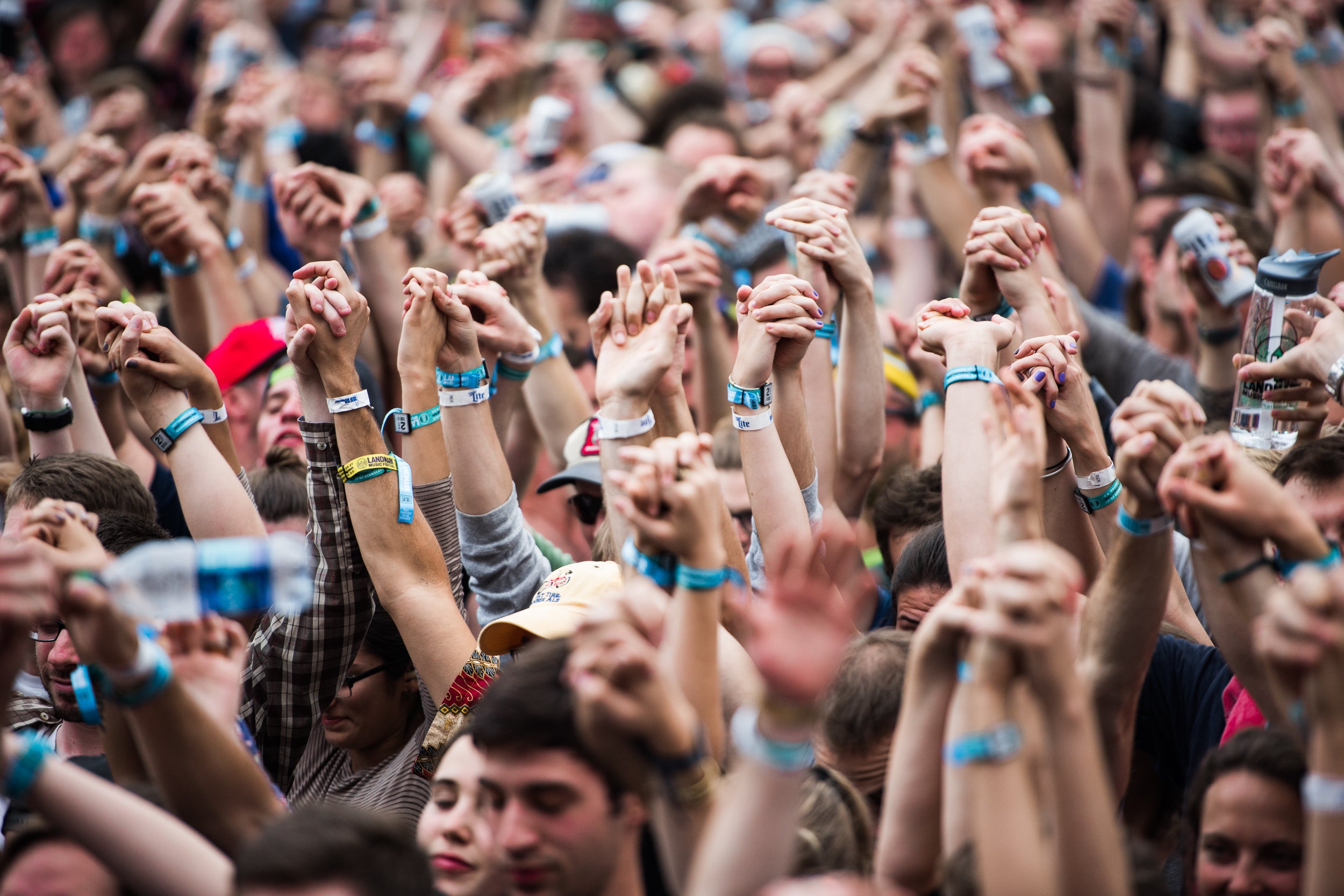 The crowd holds hands at Dan Deacon's set. via Charles Reagan Hackleman
