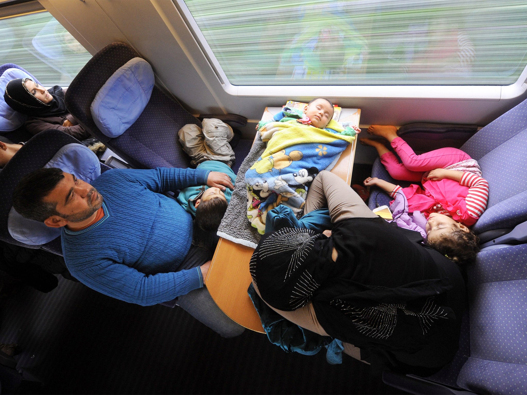 A Syrian family of four travel by train from Vienna to Passau
