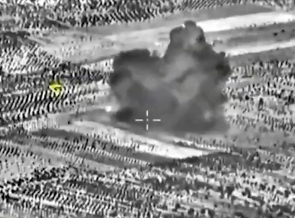 A still image taken from footage of an attack made by a Russian fighter jet in Syria